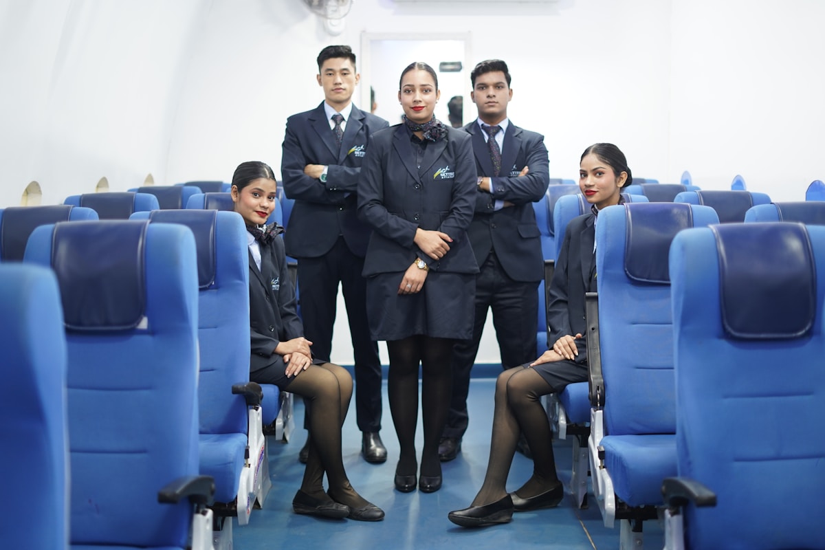 Indian boys and girls in uniform training inside aircraft cabin classroom