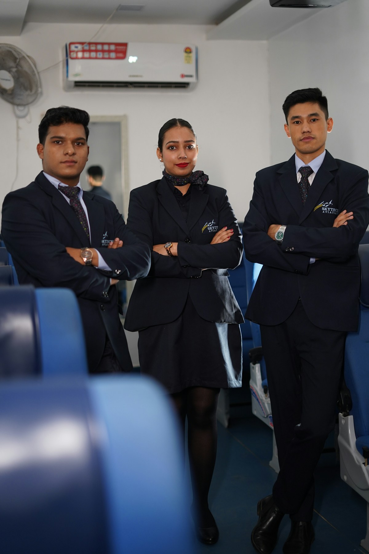 Indian male and female cabin crew students in aircraft training room