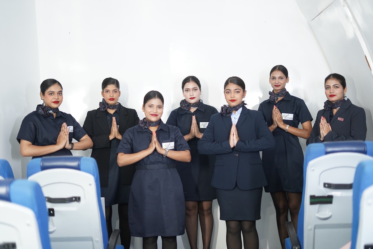 Indian cabin crew students greeting in aircraft classroom